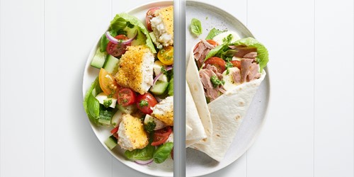 Split plate featuring crumbed hoki with fresh summer salad on one side, and tuna wraps with lettuce and cherry tomatoes on the other.
