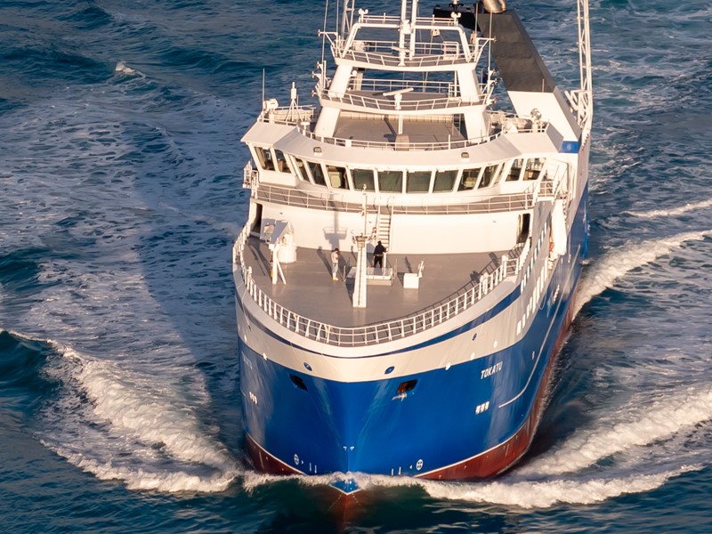 Close-up view of Sealord’s state-of-the-art fishing vessel “Tokatu” cutting through ocean waters, showcasing its modern design and scale.