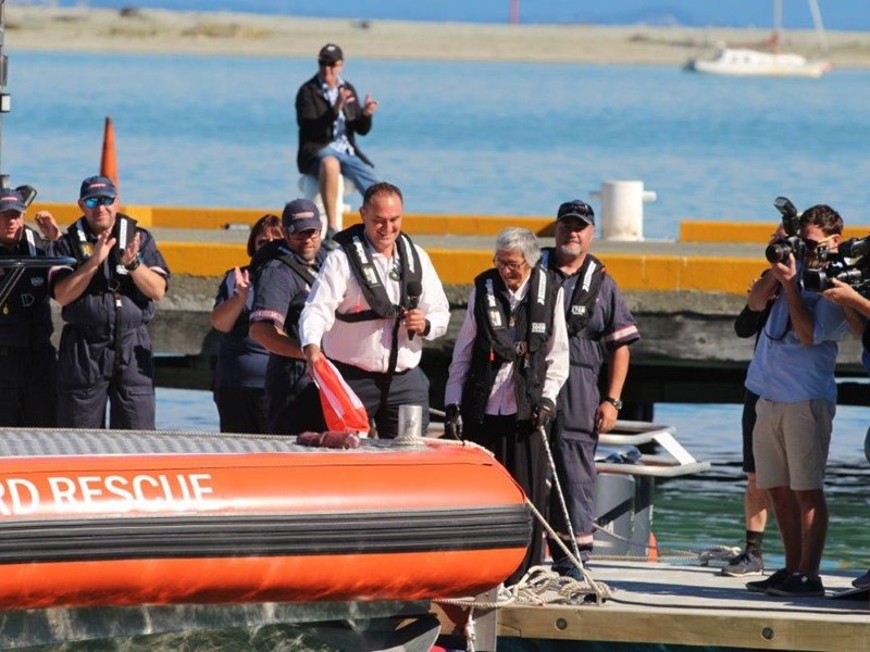 Sealords CEO in a life jacket with others surrounding him, try out the new sealords rescue life vessel Nz