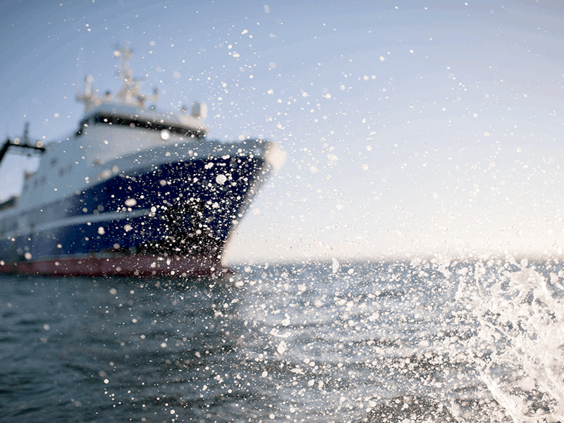 sealord vessel in the sea with wave splashing over the camera